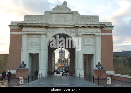 Menin gate WW1 war memorial  with St. Martins cathedral in the background of the old town square in Ypres, Belgium. Stock Photo