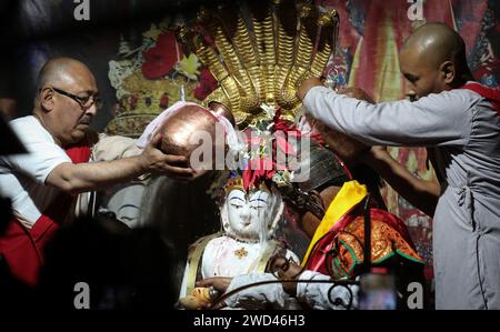 Kathmandu, Bagmati, Nepal. 18th Jan, 2024. Priests bath an idol of Seto Machhendranath during an annual ceremony for worshiping the deity of Machhendranath in Kathmandu. Seto Machhendranath is known as the god of rain and both Hindus and Buddhists worship Machhendranath for good rain to prevent drought during the rice harvest season. (Credit Image: © Sunil Sharma/ZUMA Press Wire) EDITORIAL USAGE ONLY! Not for Commercial USAGE! Stock Photo