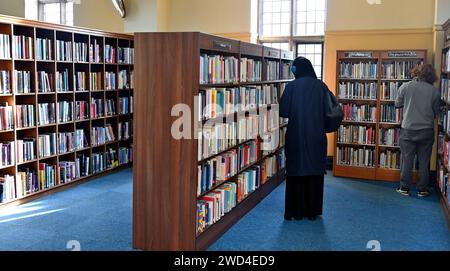 Interior of Bristol Central Library, people browsing shelves of books Stock Photo