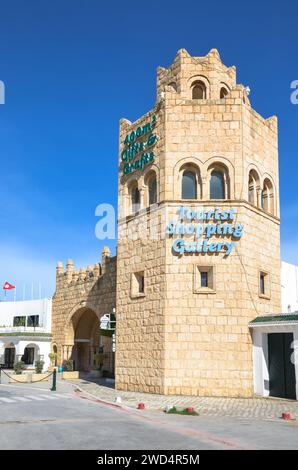 Port El Kantaoui, Sousse, Tunisia. The stone gate and tower decorate the entrance to the shopping street and marina. Stock Photo