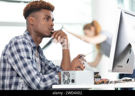 focused man writing notes in notebook Stock Photo