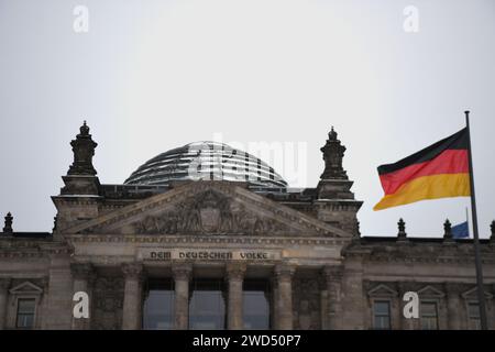 Berlin, Germany. 17th Jan, 2024. A German flag flies in front of the Reichstag building in Berlin. Credit: Marco Rauch/dpa/Alamy Live News Stock Photo