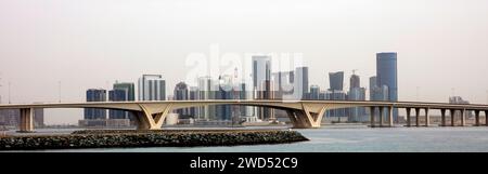 Sheikh Zayed Bridge and Abu Dhabi skyline viewed from Al Saadiyat Island Stock Photo