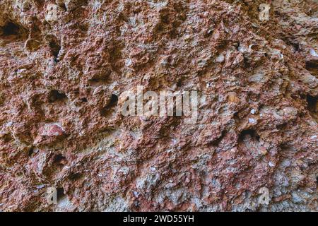 Sedimentary rock on the beach texture background. Full frame of sandstone rock pattern Stock Photo