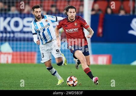 Juan Cruz of CA Osasuna duels for the ball with Brais Mendez of Real Sociedad during the Copa El Rey match between CA Osasuna and Real Sociedad at El Stock Photo