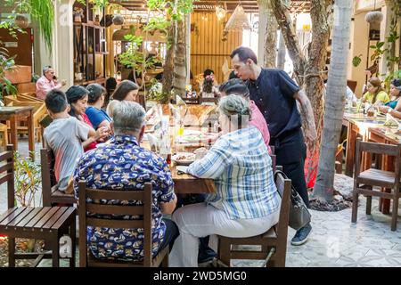 Merida Mexico,centro historico central historic district,La Bianca Tropical Social Club,inside interior,dining group families server,man men male,woma Stock Photo