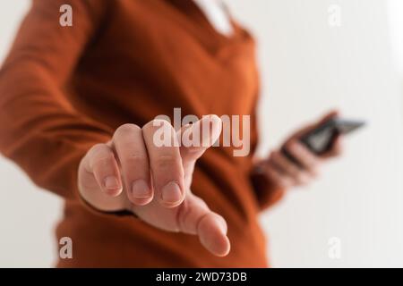 Businessman pressing an imaginary button on bokeh. Stock Photo