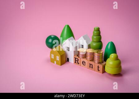 Small wooden house and the inscription for rent. Concept for sale, rental of real estate for a family. Real estate agency, sale of new houses and apar Stock Photo