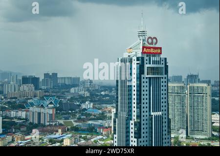 Kuala Lumpur, Malaysia - December 19, 2023: The Ambank Tower or Menara Ambank on Jalan Yap Kwan Seng, with the city skyline in background. Stock Photo