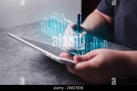 Woman use digital tablet for business cost and quality control. Strategy and project management concept. Business woman working with holographic graph Stock Photo