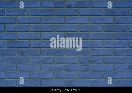 A close-up of a textured blue brick wall Stock Photo