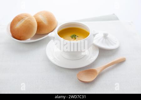 pumpkin potage soup isolated on table Stock Photo