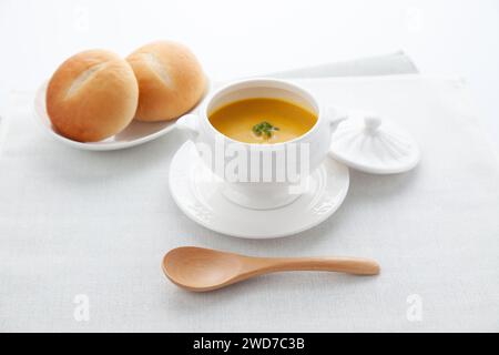 pumpkin potage soup isolated on table Stock Photo