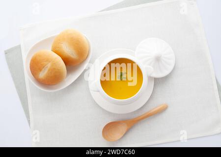 pumpkin potage soup isolated on table Stock Photo
