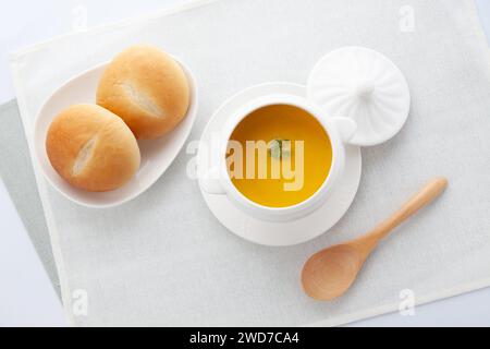 pumpkin potage soup isolated on table Stock Photo