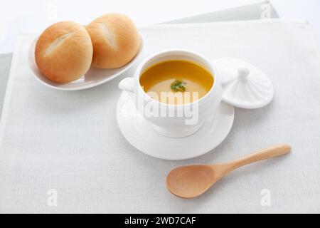 pumpkin potage soup isolated on table Stock Photo