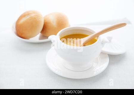pumpkin potage soup isolated on table Stock Photo