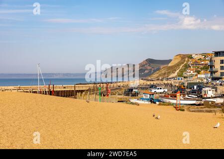 West Bay beach Bridport on the jurassic coast in Dorset,England,UK,september 2023 on a very hot autumn day with people sunbathing Stock Photo