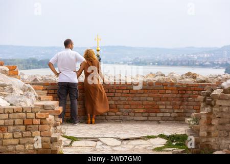 Belgrade, Serbia - September 14, 2023: People watching city panoramic view from Gardos, Zemun viewpoint, Saint Nicholas church and Danube river in sum Stock Photo