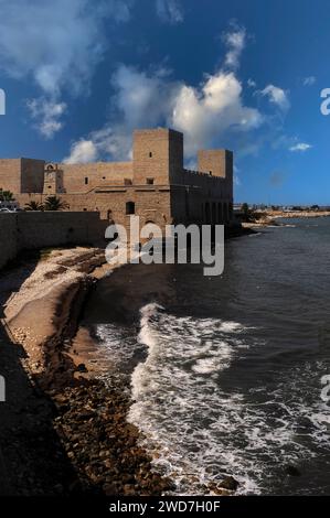 Modelled on Crusader castles, the Castello di Trani on the Adriatic coast at Trani in Puglia (Apulia), Italy.  The castle was built in the 1200s by Holy Roman Emperor, King of Sicily and Duke of Swabia, Frederick II (1194 - 1250), to protect his Kingdom of Sicily. Stock Photo