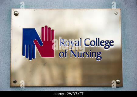 Brass name plate / plaque outside the offices of / on office / Headquarters / head office of The RCN / Royal College of Nursing. Cavendish Square. London. (137) Stock Photo