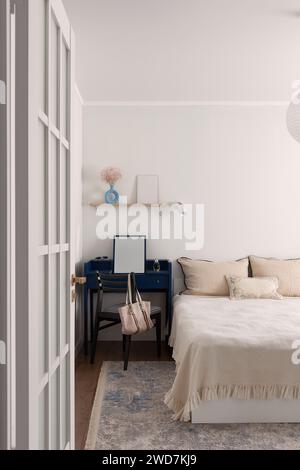 Vintage bedside bedroom area in beige Stock Photo