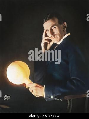 Portrait - Nikola Tesla carries a lamp for a few meters from the generator, but it continues to shine! Photo by Sarony, c 1898 colorized Stock Photo