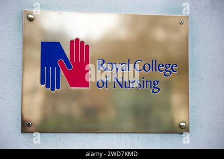 Brass name plate / plaque outside the offices of / on office / Headquarters / head office of The RCN / Royal College of Nursing. Cavendish Square. London. (137) Stock Photo