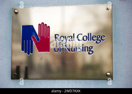 Brass name plate / plaque outside the offices of / on office / Headquarters / head office of The RCN / Royal College of Nursing. Cavendish Square. London. (137) Stock Photo