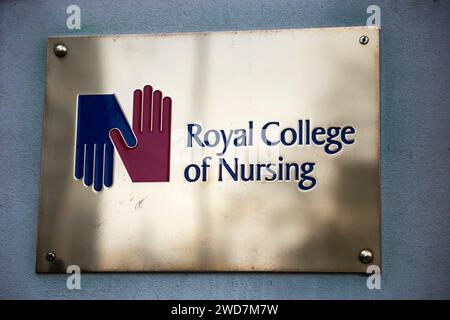 Brass name plate / plaque outside the offices of / on office / Headquarters / head office of The RCN / Royal College of Nursing. Cavendish Square. London. (137) Stock Photo