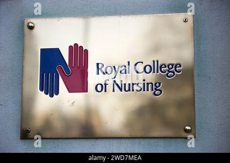 Brass name plate / plaque outside the offices of / on office / Headquarters / head office of The RCN / Royal College of Nursing. Cavendish Square. London. (137) Stock Photo