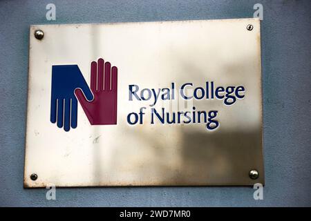 Brass name plate / plaque outside the offices of / on office / Headquarters / head office of The RCN / Royal College of Nursing. Cavendish Square. London. (137) Stock Photo