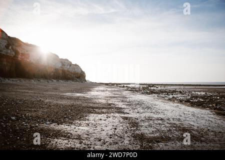 Sun Setting over Hunstanton Cliffs Beach in Norfolk, UK Stock Photo