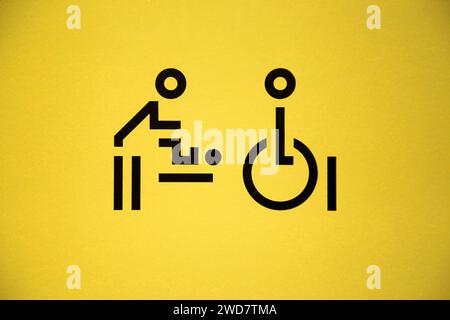 Graphic / graphics logo on a lavatory door for disabled access & baby changing toilet facility for parent with child / children / family loo. UK. (137) Stock Photo