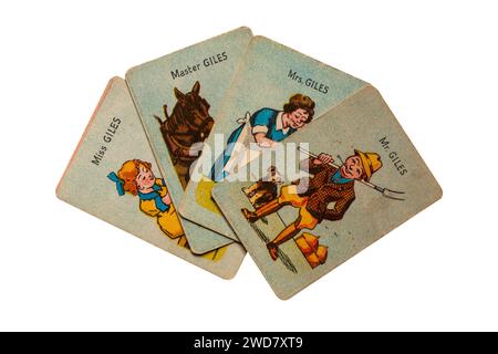 old retro Happy Families playing cards isolated on white background - the Giles family, Mr Giles the farmer with wife, son and daughter - UK Stock Photo