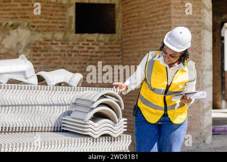 African black women worker work in construction site for site inspector job checking project progress Stock Photo