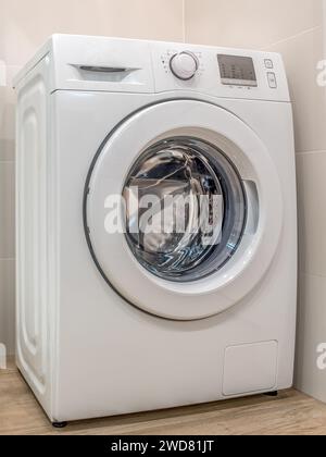 White washing machine in the laundry room Stock Photo