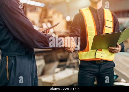Engineer Team dealing cooperation shaking hand together. Engineering group worker enforce teamwork working project successful Stock Photo