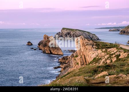 Beautiful coastal landscape at sunset along the Broken Coast of Liencres, Cantabria, Spain Stock Photo