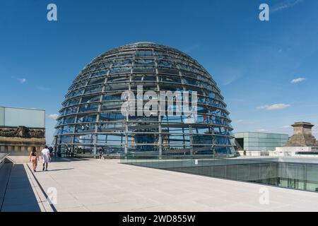 Berlin, Germany-august 10, 2022:people visit the Norman Foster's glass dome located on the Reichstag building in Berlin during a sunny day Stock Photo