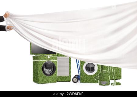 Male hands pulling a white piece of cloth in front of energy-efficient appliances isolated on white background Stock Photo