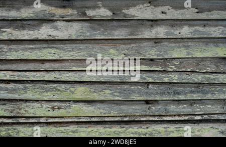 Detail of and old hut wooden wall with worn out paint Stock Photo