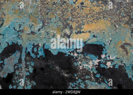 Detail of old wall texture with scraps of flaking paint layers, grunge background, selesctive focus Stock Photo