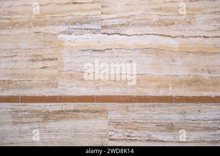 Detail of beige travertine marble tiled wall classic cladding Stock Photo