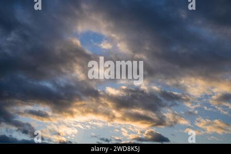 Low angle view to evening sky with dramatic clouds Stock Photo