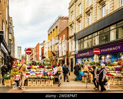 Dublin, Leinster, Ireland September 26 2023 - Flower sellers on Grafton street in Dublin City centre with shoppers about Stock Photo