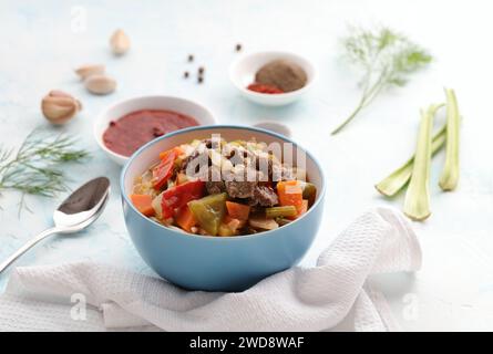 Uzbek food with noodles, vegetables and spices Lagman. Uyghur-style lagman with undercooked vegetables. Uzbek and Central Asia cuisine concept Stock Photo