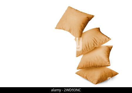 Stack of orange pillows isolated on white background. Pile of  decorative cushions for sleeping and resting, home interior, house decor. Stock Photo