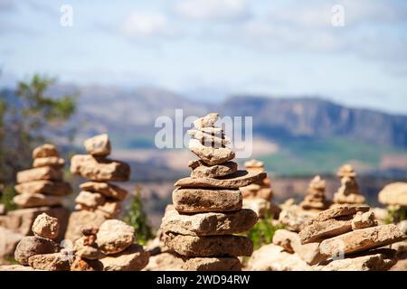 Cairns, stones and rocks balanced and stacked in shapes Stock Photo
