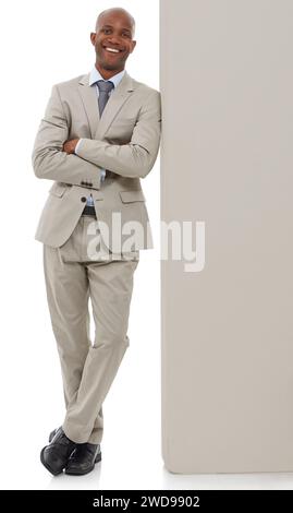 Happy businessman with arms crossed leaning on wall Stock Photo - Alamy